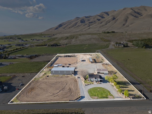 115 East 1600th Street North Santaquin, UT 84655 - Photo 4 of 52 Expansive property featuring a single-story residence, multiple outbuildings, and a large riding arena
