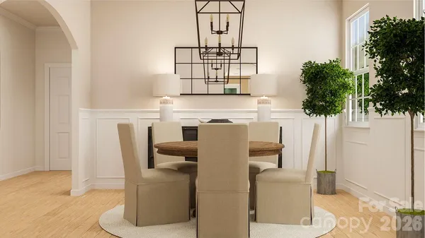 a view of living room with furniture and a potted plant