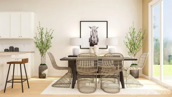 a dining room with furniture and wooden floor