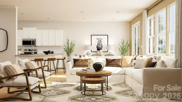 a living room with furniture a flat screen tv and a large window