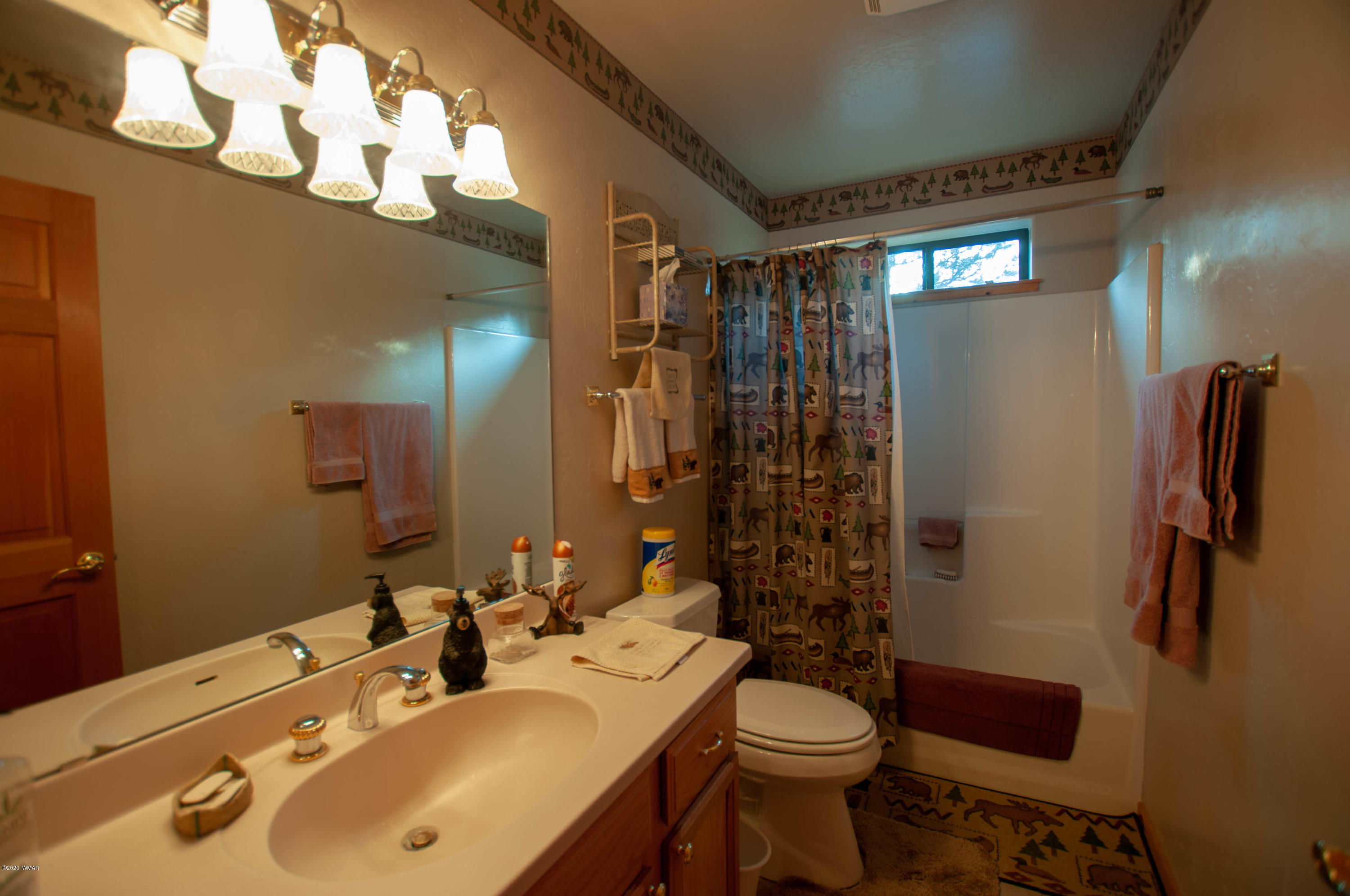 2836 Lodgepole Road Overgaard, AZ 85933 - Photo 10 of 25 a bathroom with a sink a toilet and shower