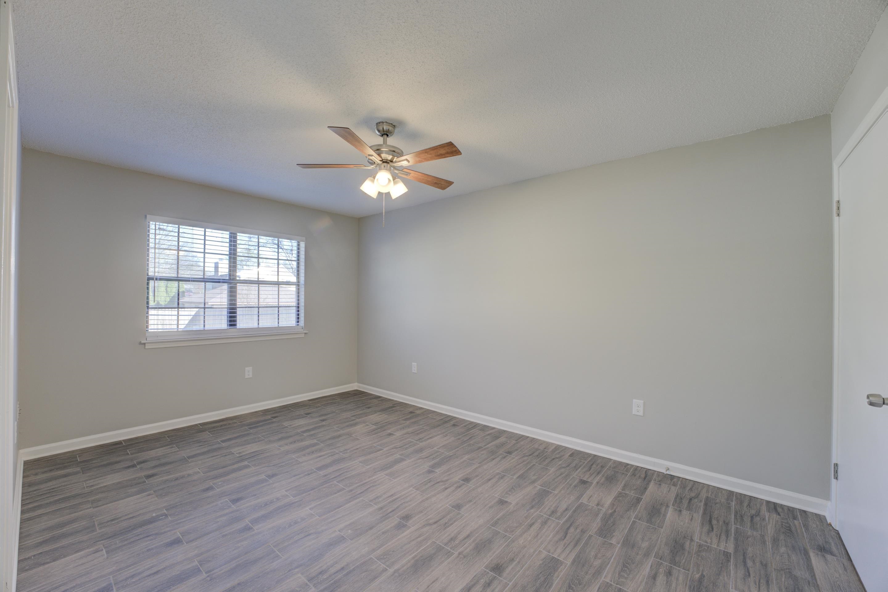 3808 Haynes Road Bartlett, TN 38133 - Photo 15 of 24 Spare room featuring hardwood / wood-style flooring, ceiling fan, and a textured ceiling