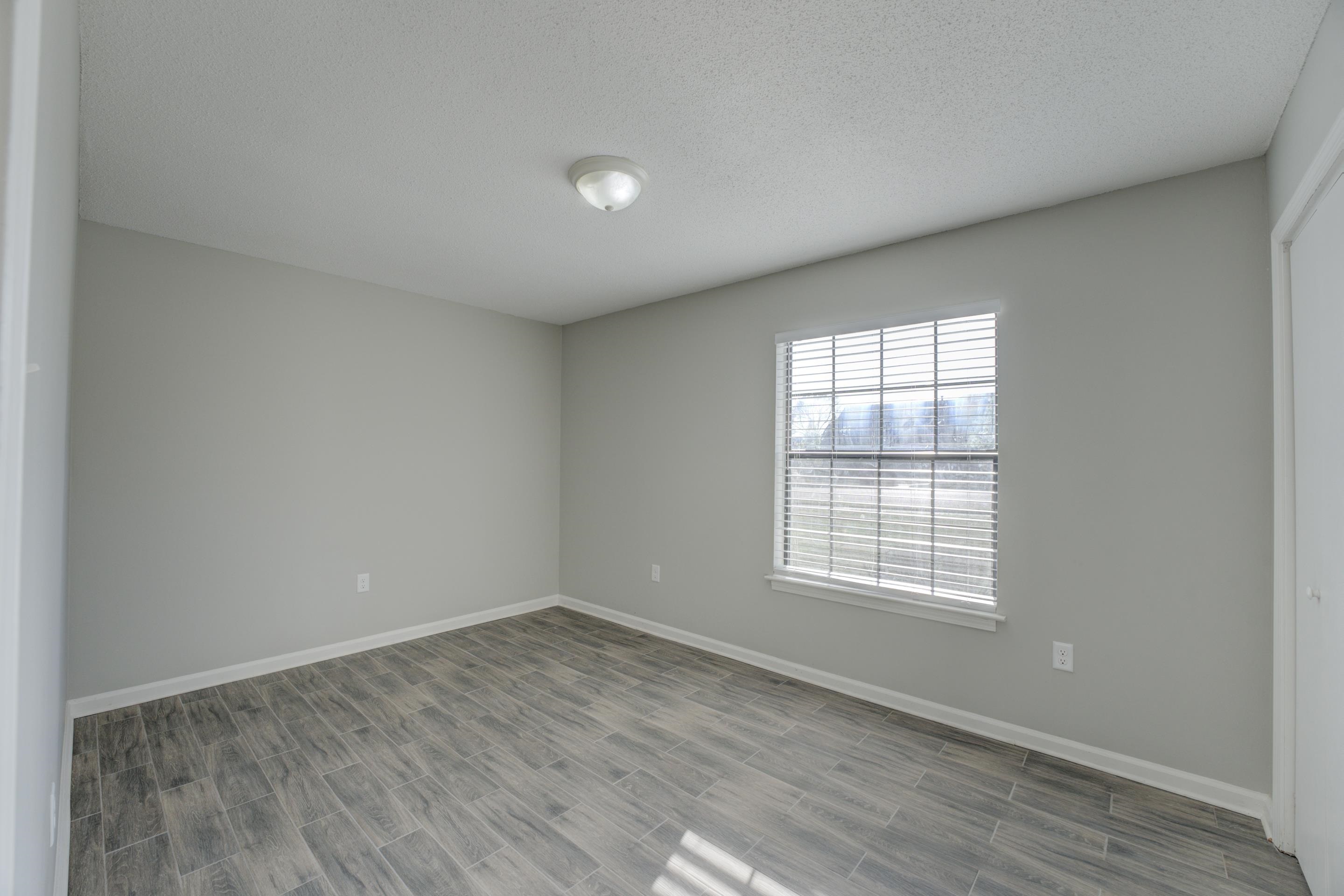 3808 Haynes Road Bartlett, TN 38133 - Photo 17 of 24 Empty room featuring light wood-type flooring and a textured ceiling