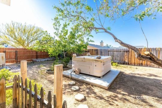 422 Vista Street Ridgecrest, CA 93555 - Photo 33 of 38 a view of a house with backyard and sitting area