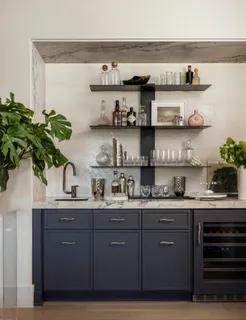 a kitchen with stainless steel appliances a sink and cabinets