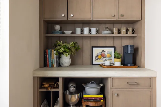 a kitchen with a stove and cabinets