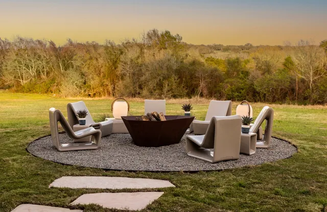 a view of a lake with furniture