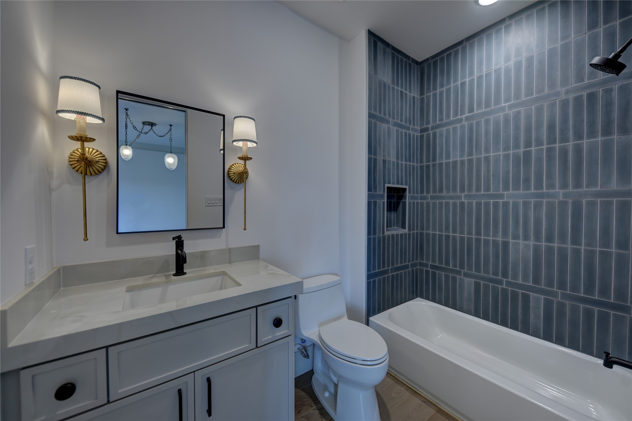 114 Turney Trace Round Top, TX 78954 - Photo 32 of 44 a bathroom with a toilet a sink a shower and mirror