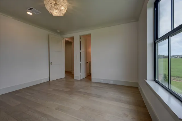 a bathroom with a granite countertop sink a toilet and bathtub