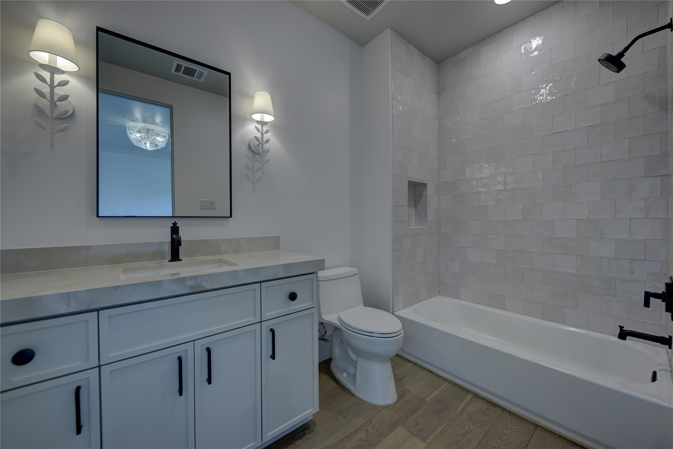 114 Turney Trace Round Top, TX 78954 - Photo 35 of 44 a bathroom with a granite countertop sink a toilet and bathtub