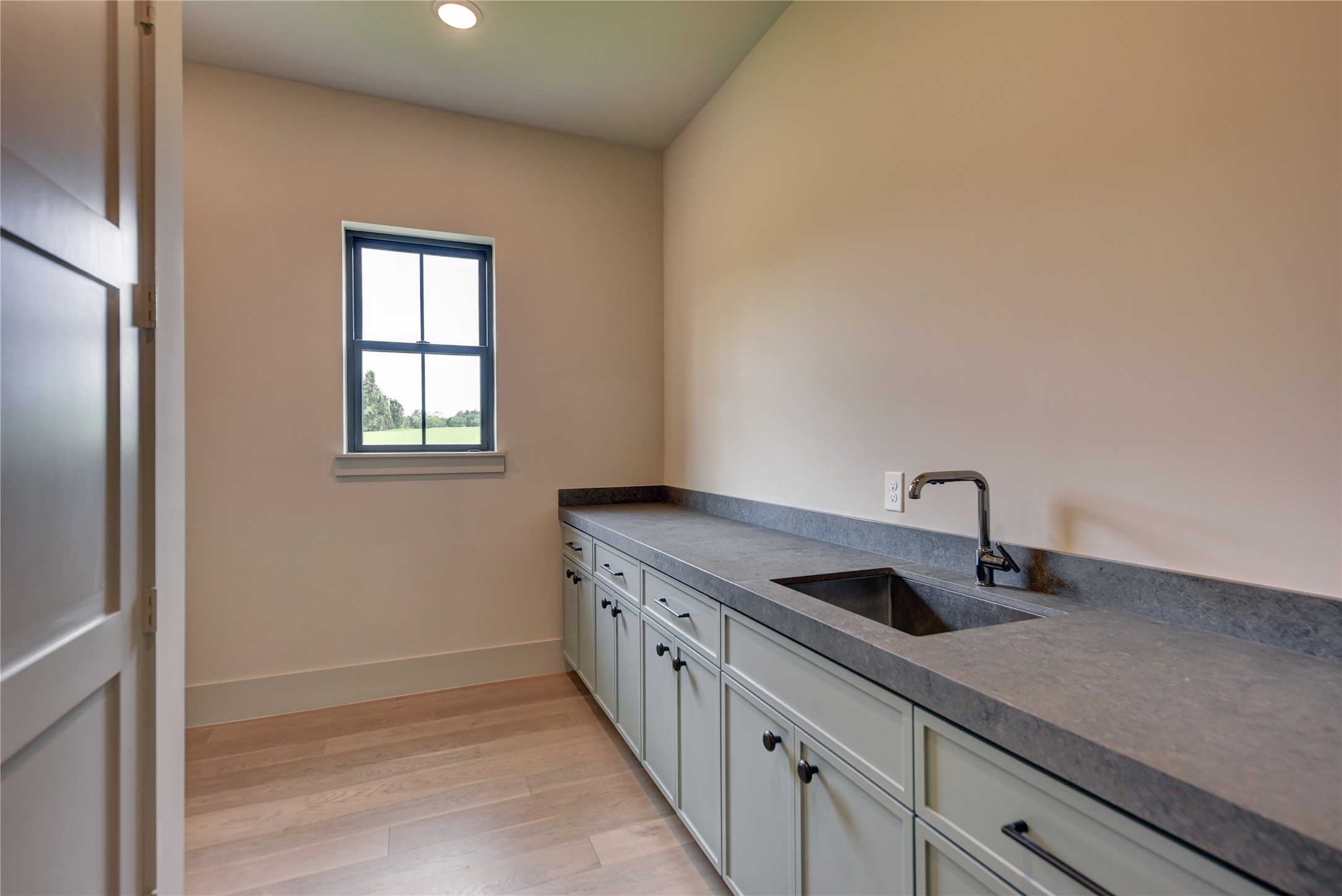 114 Turney Trace Round Top, TX 78954 - Photo 38 of 44 a kitchen with a sink and cabinets