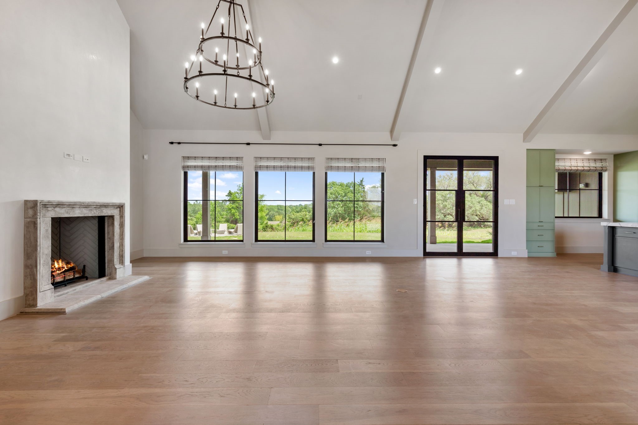 114 Turney Trace Round Top, TX 78954 - Photo 5 of 44 a view of an empty room with window and fire place