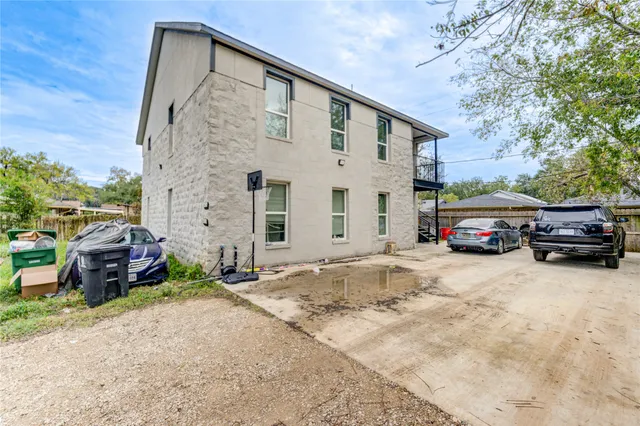 an aerial view of a house with a yard