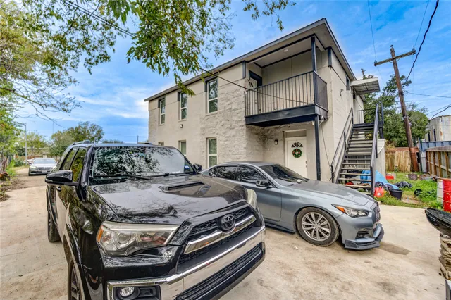 an aerial view of a house with a swimming pool yard and lake view