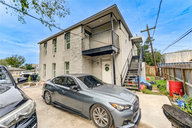 an aerial view of residential houses with outdoor space
