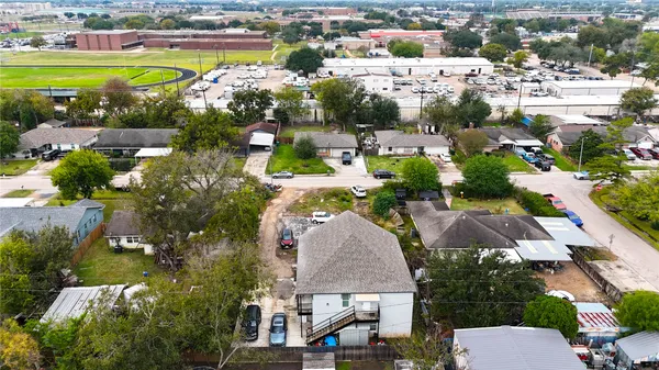 an aerial view of a house with a swimming pool yard and lake view
