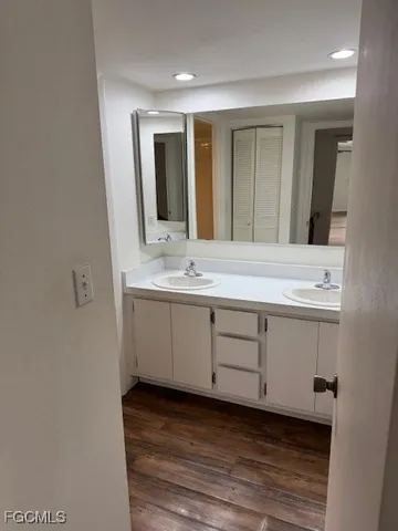 a bathroom with a sink and mirror