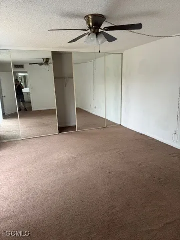 a view of a hallway with a window