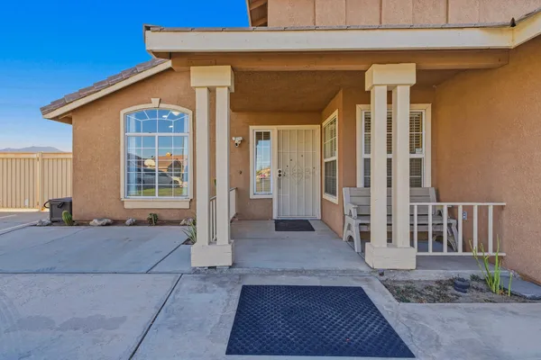 a view of a house with wooden floor and fence