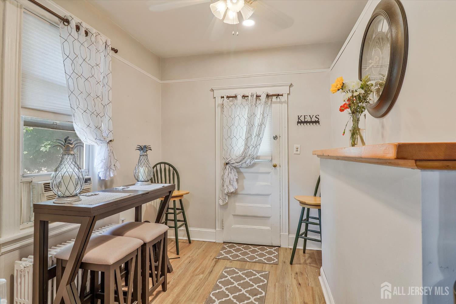 a dining room with furniture and wooden floor