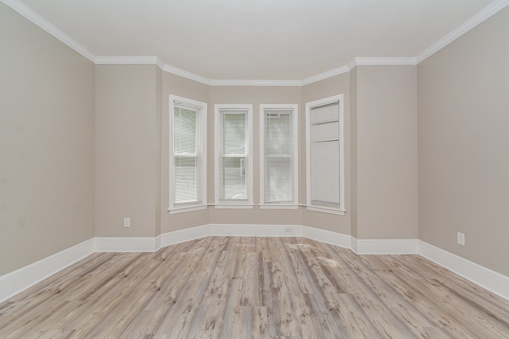 48 Washington Street Lawrence, MA 01841 - Photo 11 of 38 a view of an empty room with wooden floor and a window