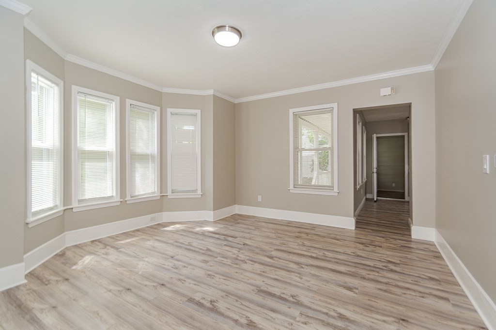 48 Washington Street Lawrence, MA 01841 - Photo 12 of 38 a view of an empty room with wooden floor and a window