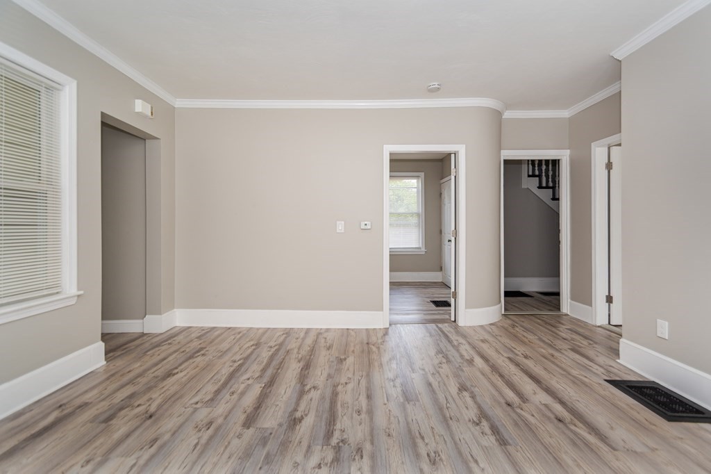 48 Washington Street Lawrence, MA 01841 - Photo 14 of 38 a view of a room with wooden floor and a window