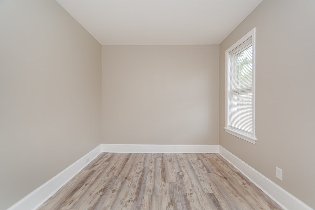 48 Washington Street Lawrence, MA 01841 - Photo 15 of 38 a view of a room that has wooden floor and windows in it