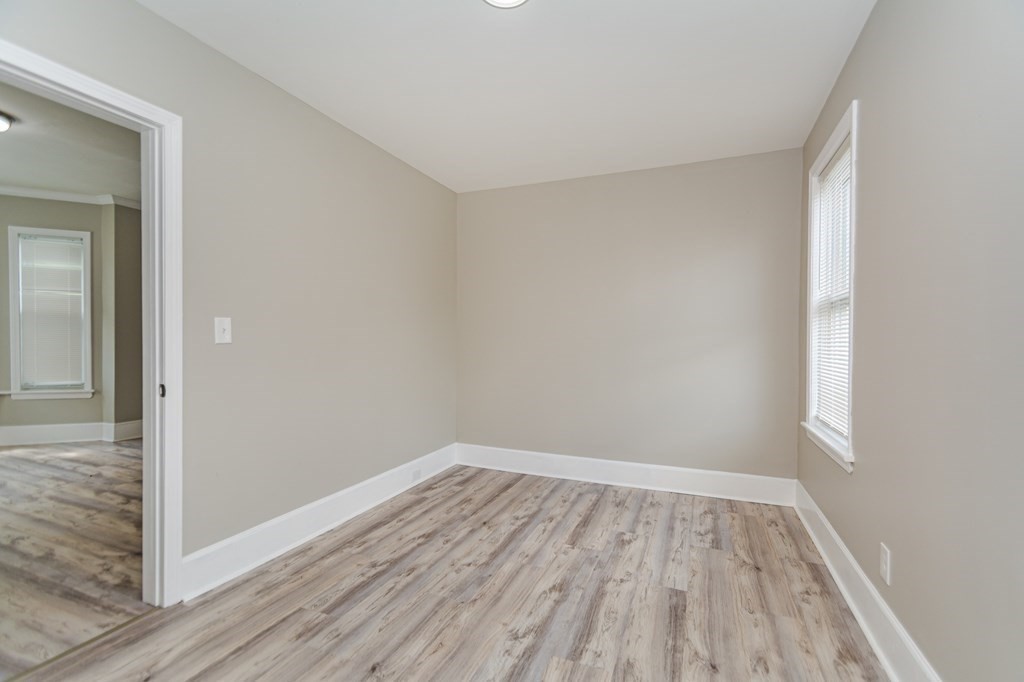 48 Washington Street Lawrence, MA 01841 - Photo 16 of 38 wooden floor in an empty room