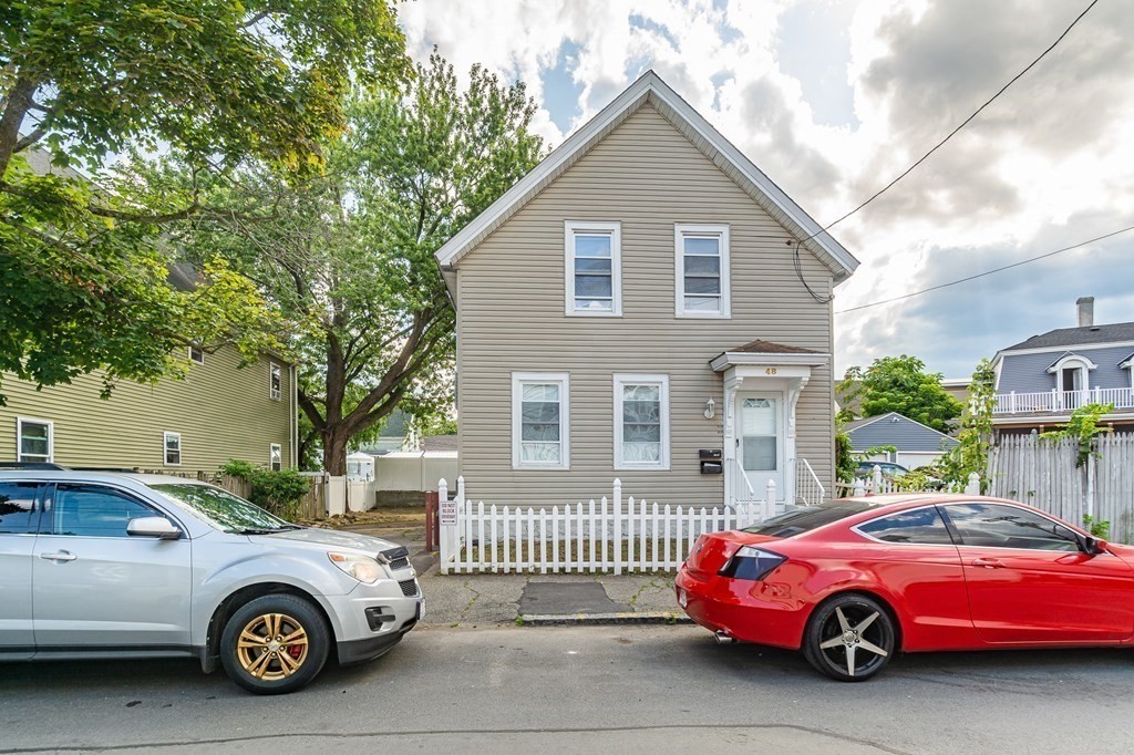 48 Washington Street Lawrence, MA 01841 - Photo 2 of 38 a car is parked in front of a house