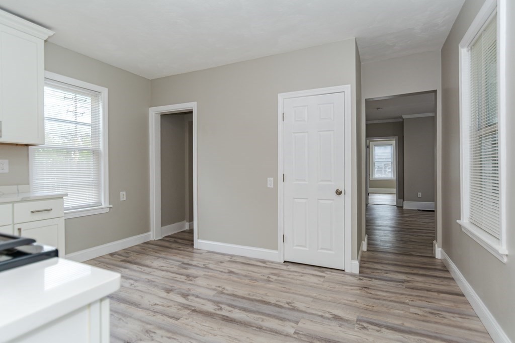 48 Washington Street Lawrence, MA 01841 - Photo 21 of 38 a view of a livingroom with wooden floor and a window