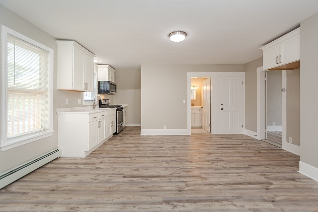 48 Washington Street Lawrence, MA 01841 - Photo 27 of 38 a view of a kitchen with a sink and dishwasher wooden floor
