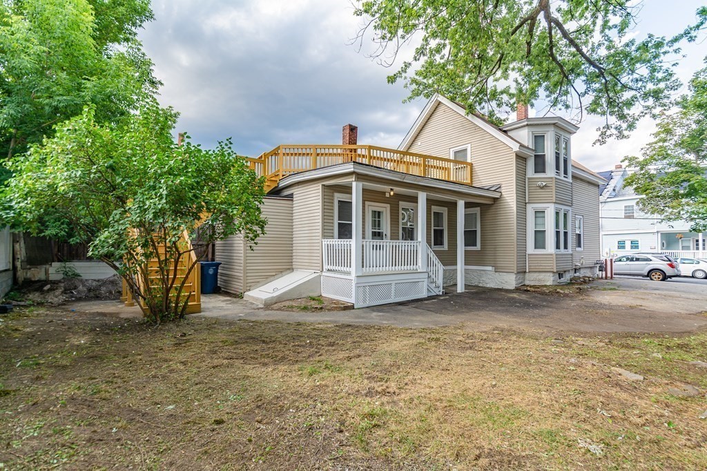 48 Washington Street Lawrence, MA 01841 - Photo 3 of 38 a view of a house with a yard