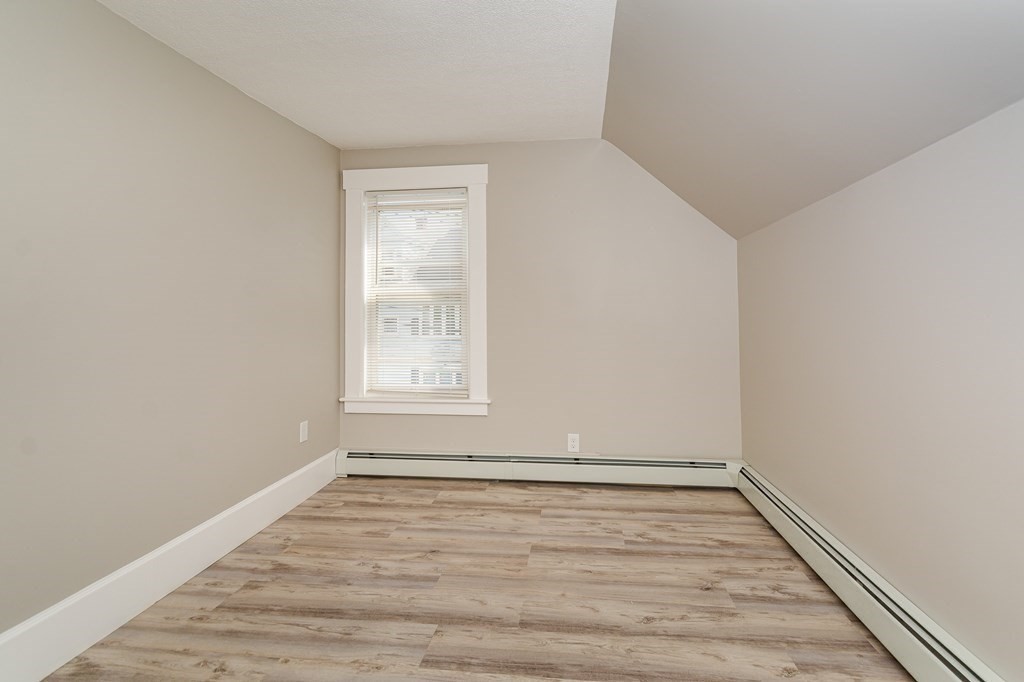 48 Washington Street Lawrence, MA 01841 - Photo 31 of 38 wooden floor in an empty room
