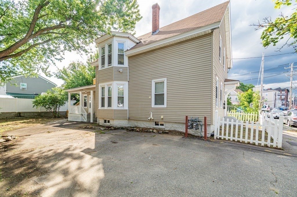 48 Washington Street Lawrence, MA 01841 - Photo 5 of 38 a backyard of a house