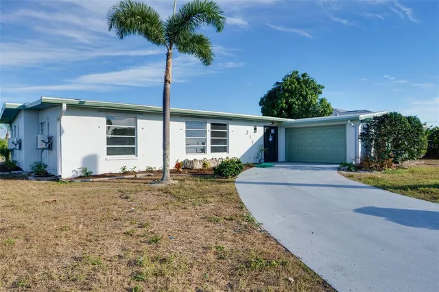 a view of a kitchen with a sink and cabinet area