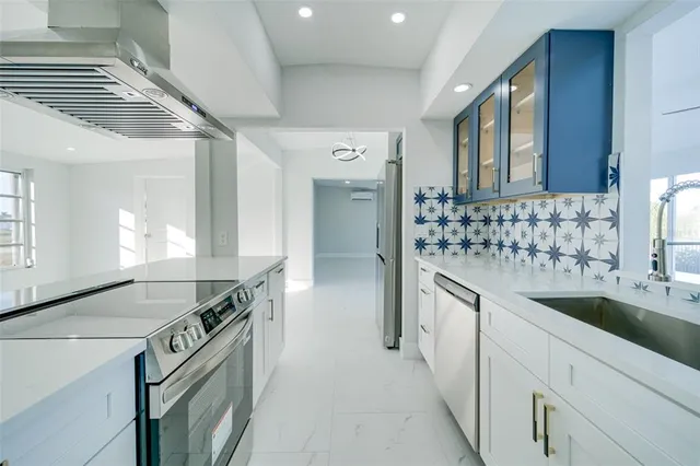 a view of a hallway with granite countertop a couch