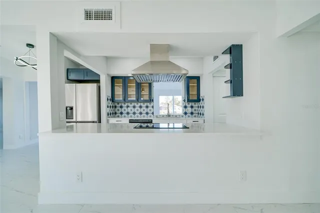 an empty room with window and windows