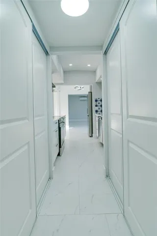 a view of a livingroom with a ceiling fan and window