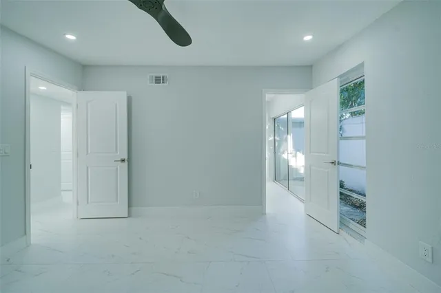 a bathroom with a toilet a sink and a mirror