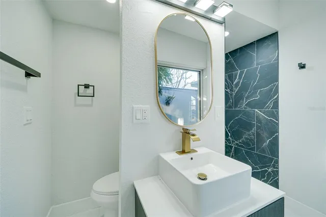 a view of a balcony with an outdoor space and seating area