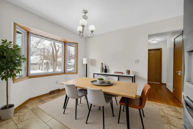 a view of a dining room with furniture window and outside view