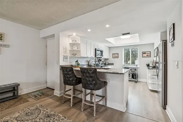 a kitchen with a table and chairs in it