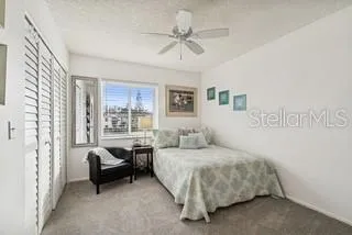 a bedroom with a bed and furniture