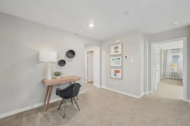 a bathroom with double vanity sinks and a shower