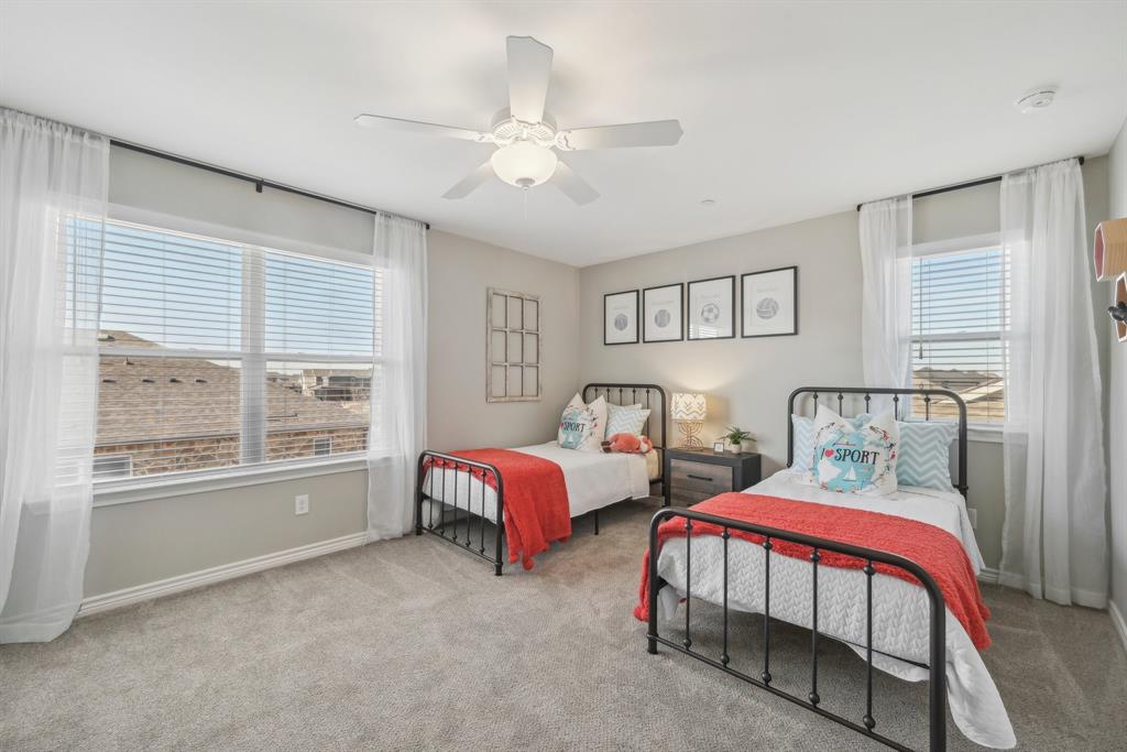 4430 Prairie Crossing, Unit 100 Prosper, TX 75078 - Photo 22 of 34 Bedroom with light carpet and ceiling fan