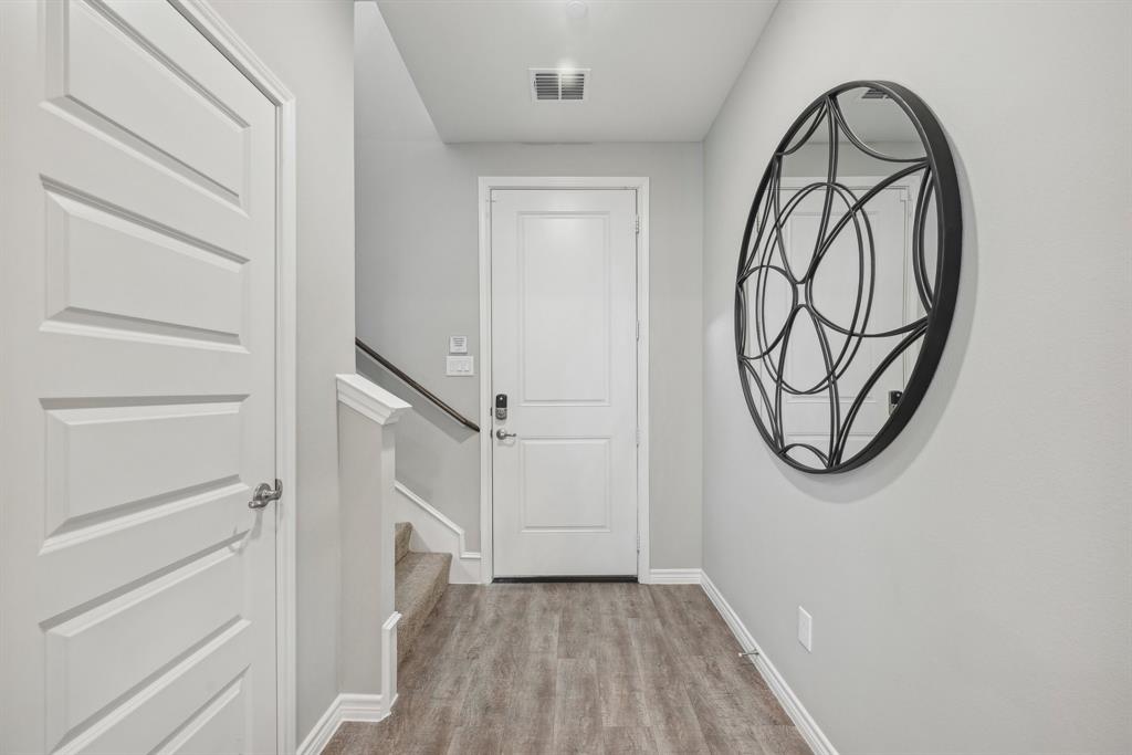4430 Prairie Crossing, Unit 100 Prosper, TX 75078 - Photo 27 of 38 a view of a livingroom with wooden floor
