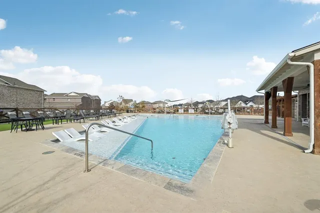 a view of a patio with swimming pool