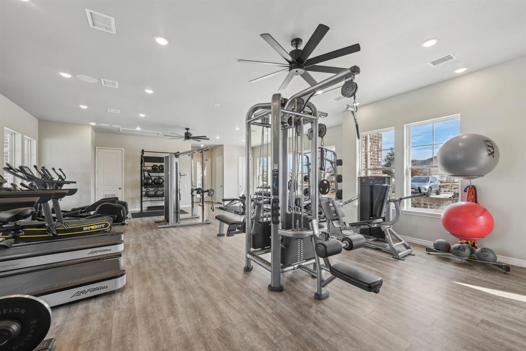 4430 Prairie Crossing, Unit 100 Prosper, TX 75078 - Photo 31 of 34 Gym with ceiling fan and light wood-type flooring