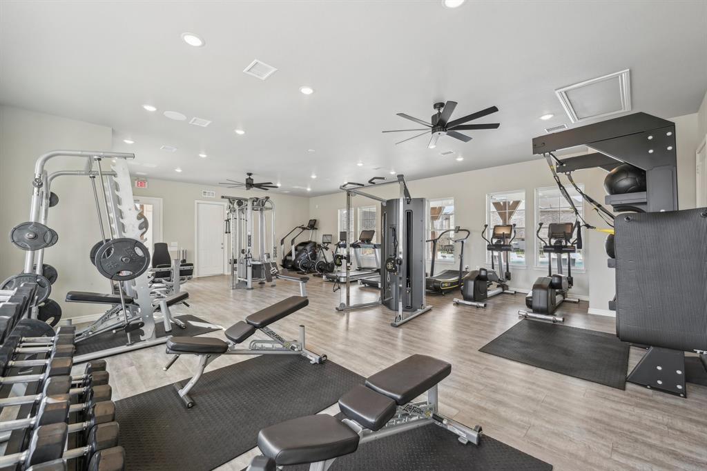 4430 Prairie Crossing, Unit 100 Prosper, TX 75078 - Photo 32 of 34 Workout area with ceiling fan and light hardwood / wood-style flooring